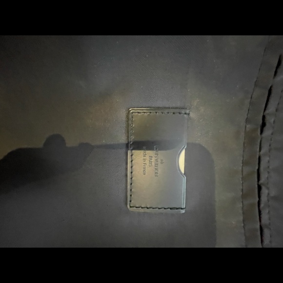 This is a Louis Vuitton travel bag black. - Picture 13 of 16